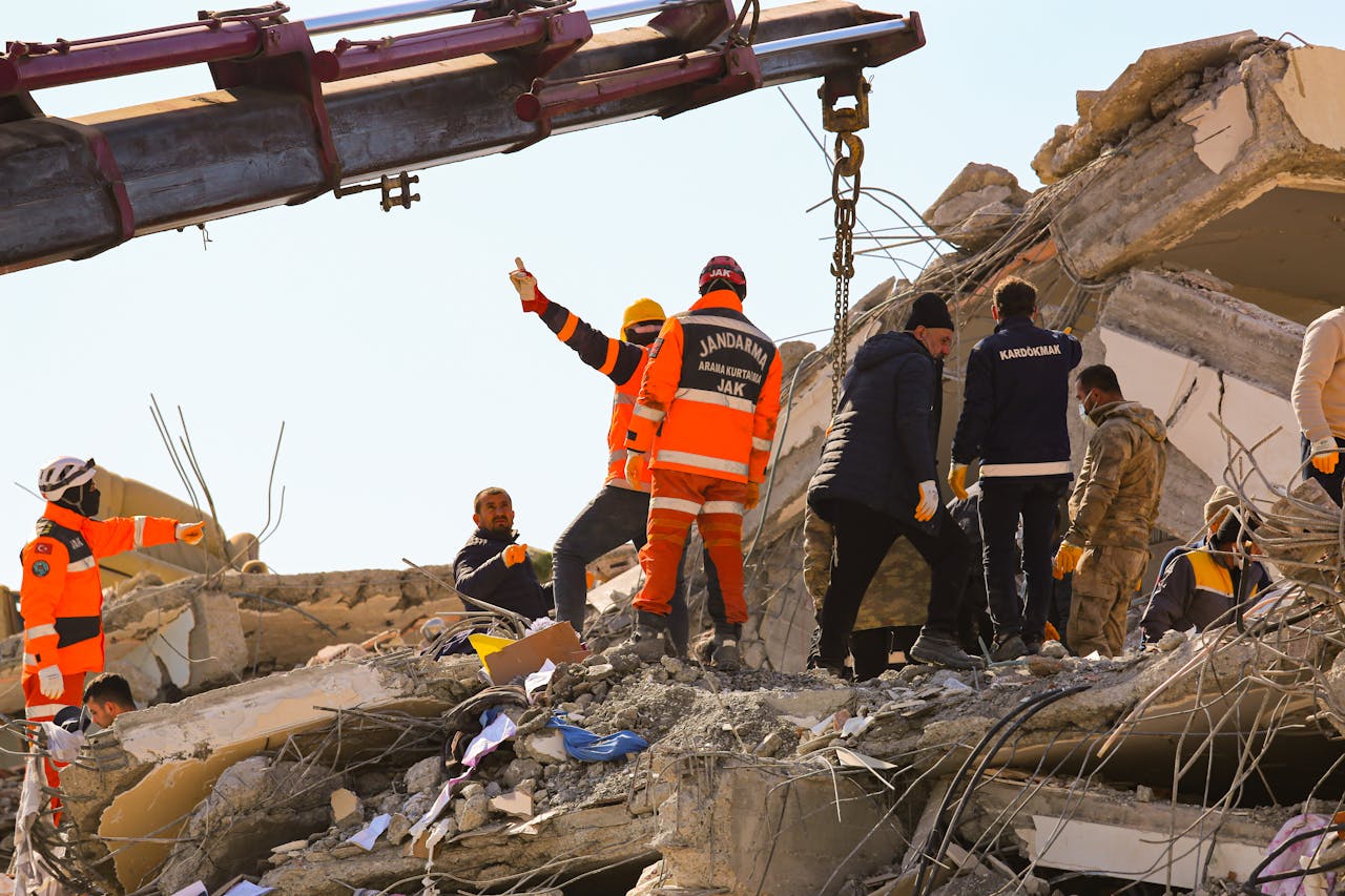 Rescue workers searching through rubble after an earthquake, showcasing teamwork and determination.
